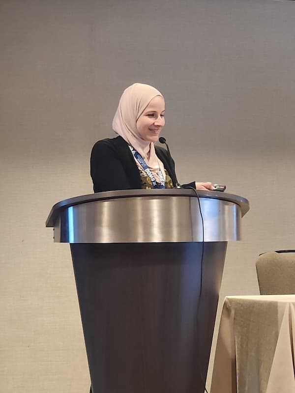 Nadine Housri speaking at a conference