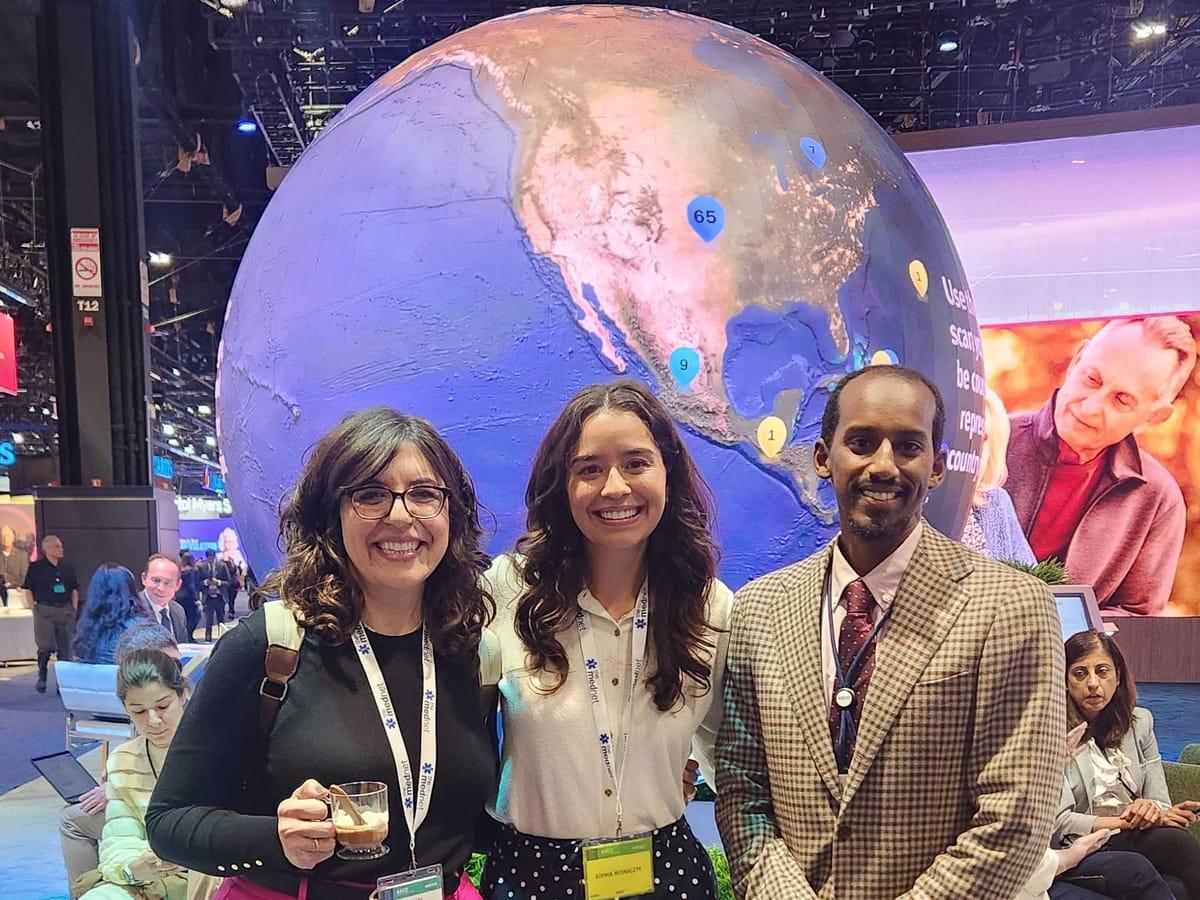 Members of the Mednet team on the exhibit floor at a medical conference