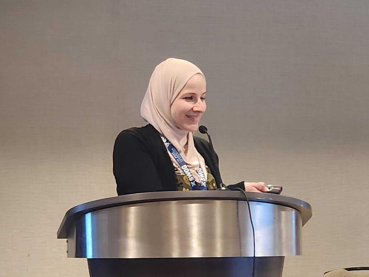 Nadine Housri presenting at a medical conference